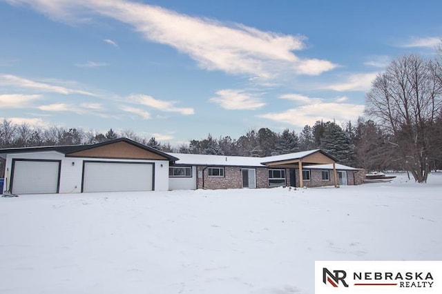 ranch-style home with a garage