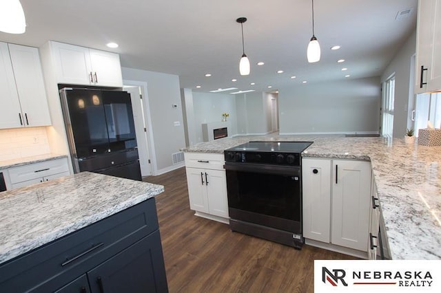 kitchen with visible vents, dark wood finished floors, recessed lighting, white cabinets, and black appliances