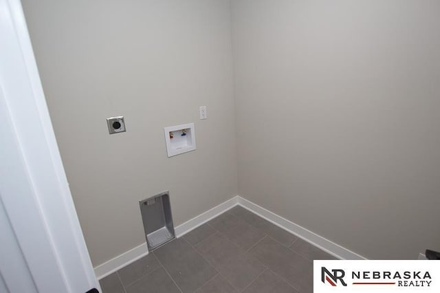 clothes washing area with baseboards, hookup for an electric dryer, washer hookup, and laundry area