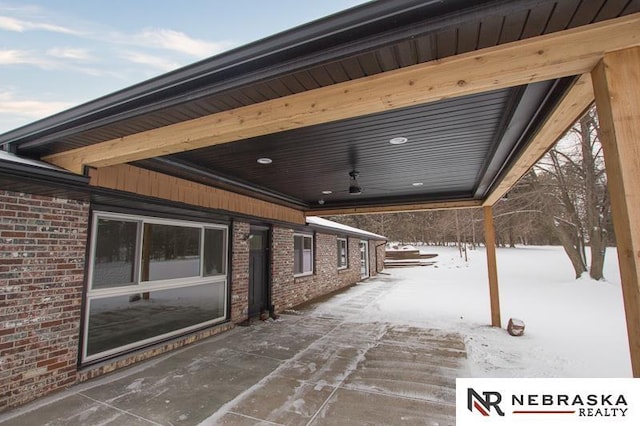 view of snow covered patio