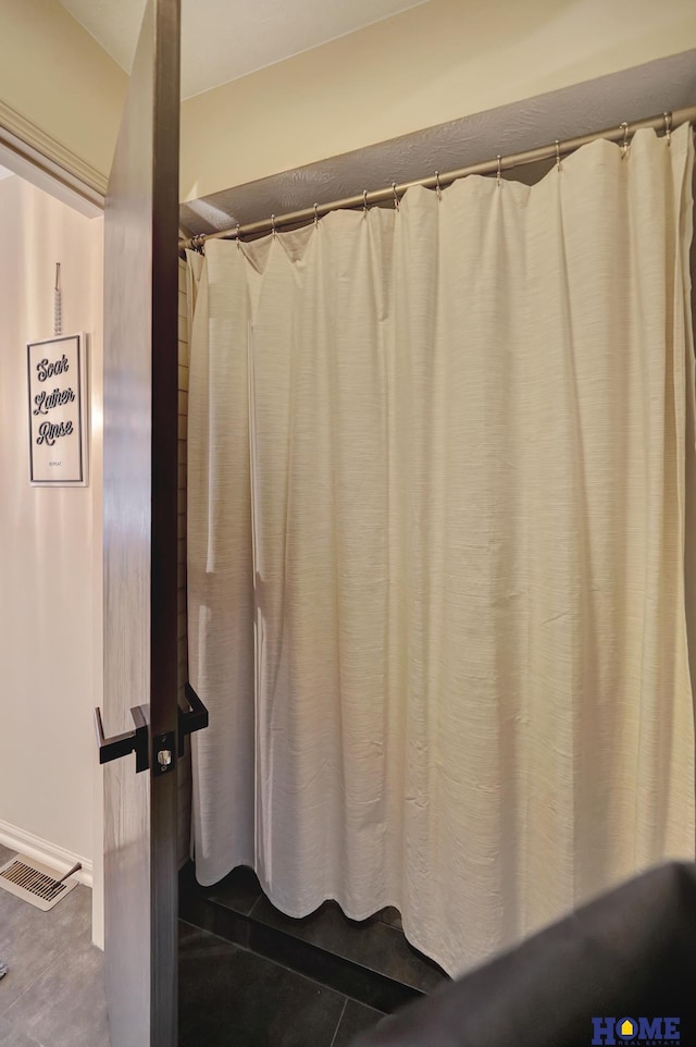 bathroom with tile patterned floors and visible vents