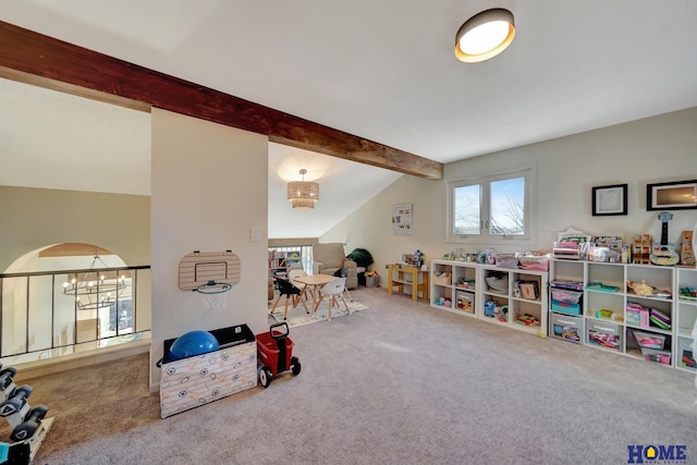 playroom with carpet floors, an inviting chandelier, and vaulted ceiling with beams