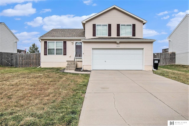 view of front of home featuring driveway, an attached garage, a front yard, and fence