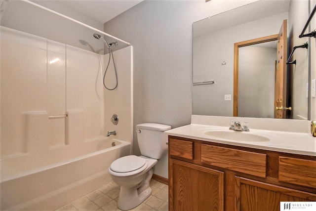 bathroom with tile patterned floors, toilet, vanity, and washtub / shower combination