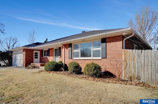 ranch-style house with a garage, brick siding, a front yard, and fence