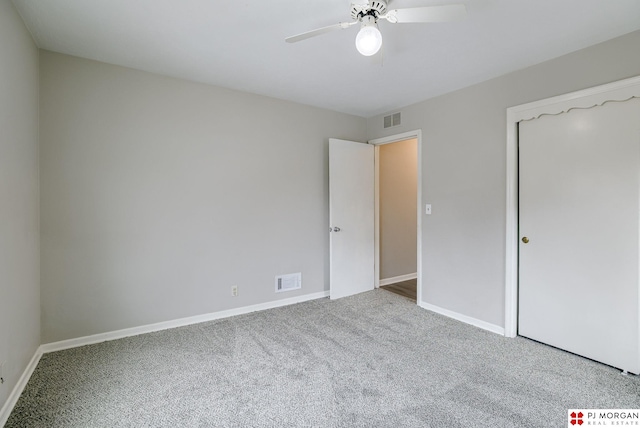 unfurnished bedroom with visible vents, baseboards, carpet, and ceiling fan