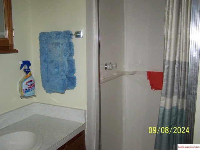 bathroom with vanity and a shower with curtain