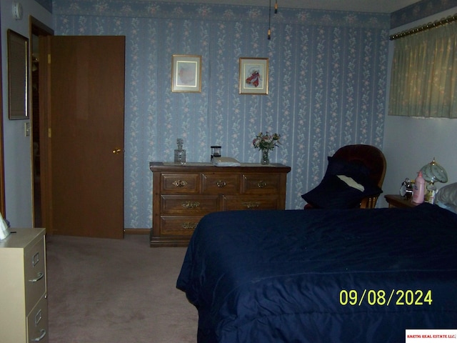 bedroom featuring carpet flooring and wallpapered walls