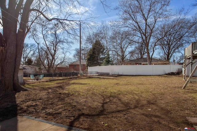 view of yard featuring fence