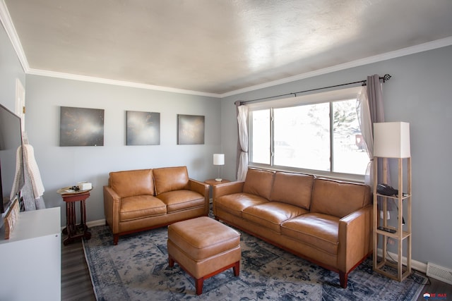 living room featuring visible vents, crown molding, baseboards, and wood finished floors