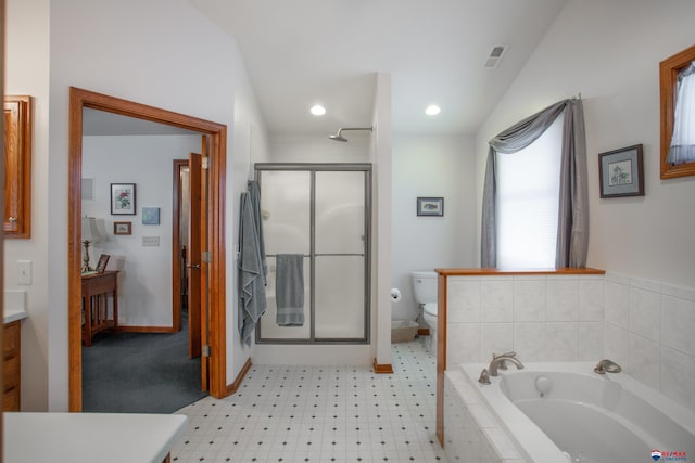 bathroom with toilet, a stall shower, lofted ceiling, a bath, and vanity