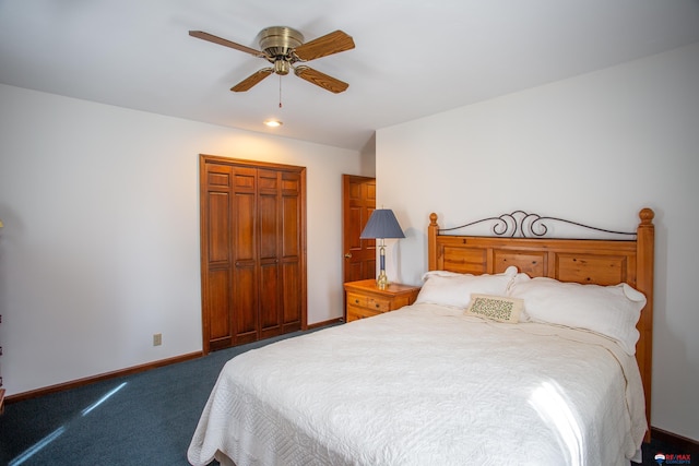 carpeted bedroom featuring a closet, ceiling fan, and baseboards