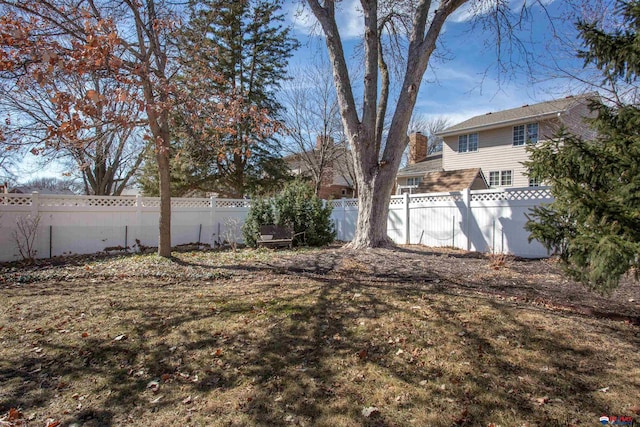 view of yard with a fenced backyard