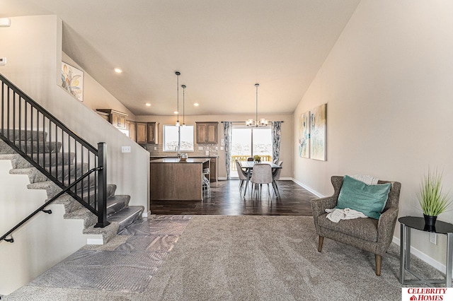 interior space with a center island, recessed lighting, an inviting chandelier, baseboards, and dark wood-style flooring