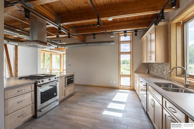 kitchen with beam ceiling, a sink, tasteful backsplash, stainless steel appliances, and wood ceiling