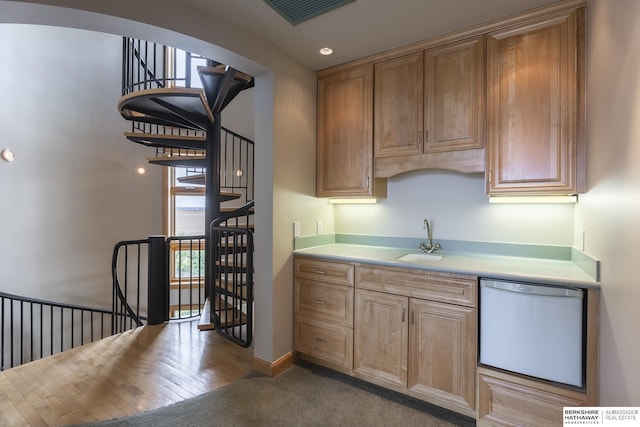 kitchen featuring a sink, light countertops, visible vents, and white dishwasher