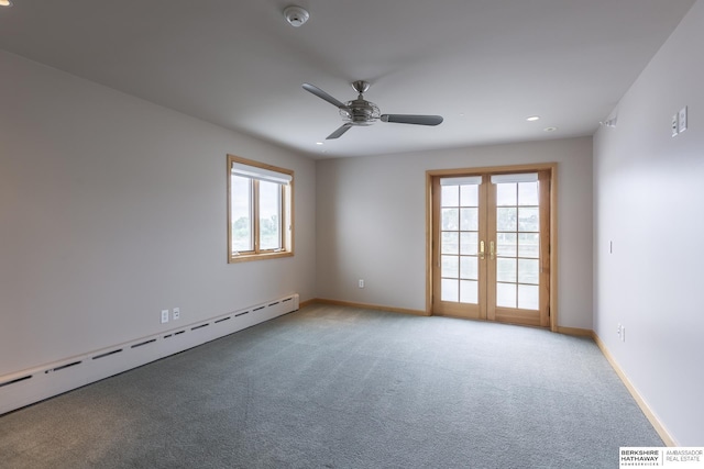 carpeted empty room featuring french doors, baseboards, a wealth of natural light, and a baseboard radiator