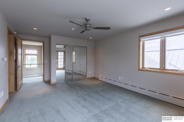 unfurnished bedroom with recessed lighting, carpet, baseboards, and a baseboard radiator