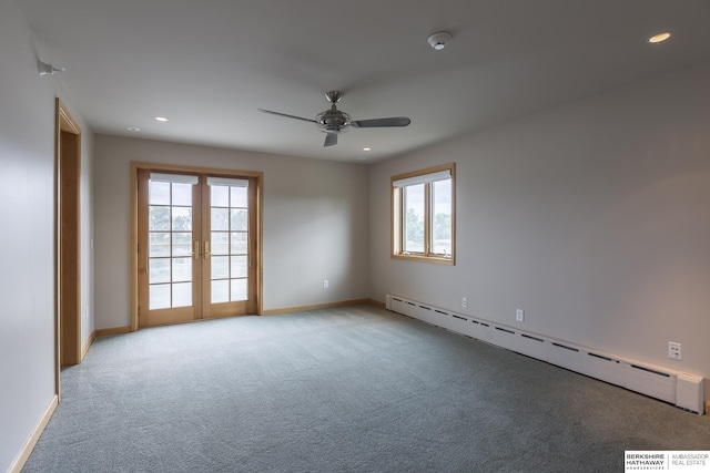 empty room with a healthy amount of sunlight, light carpet, french doors, and a baseboard radiator