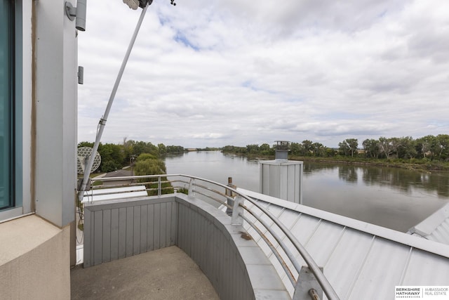 balcony featuring a water view