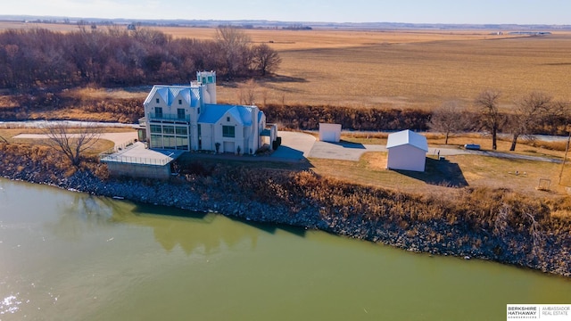 aerial view with a rural view and a water view