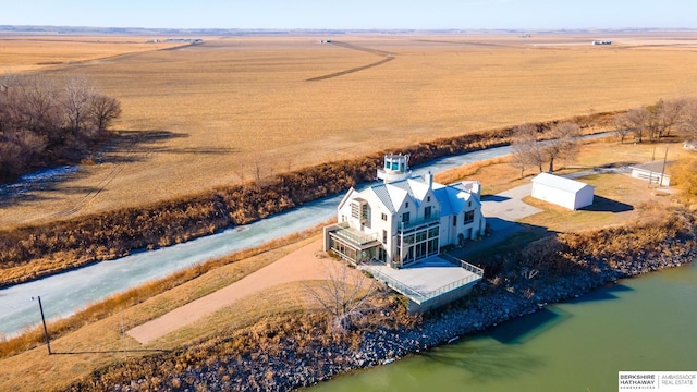 drone / aerial view with a water view and a rural view