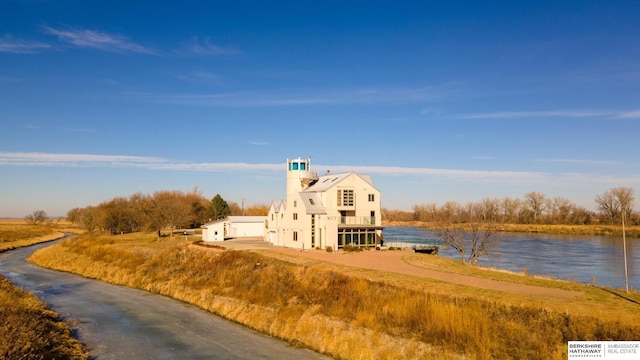 exterior space with a water view