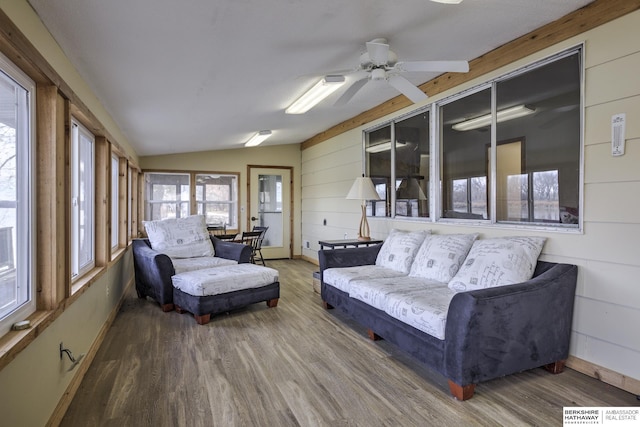 sunroom / solarium with vaulted ceiling and a ceiling fan