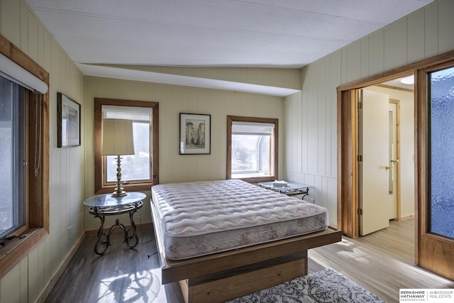 bedroom featuring light wood-type flooring and baseboards