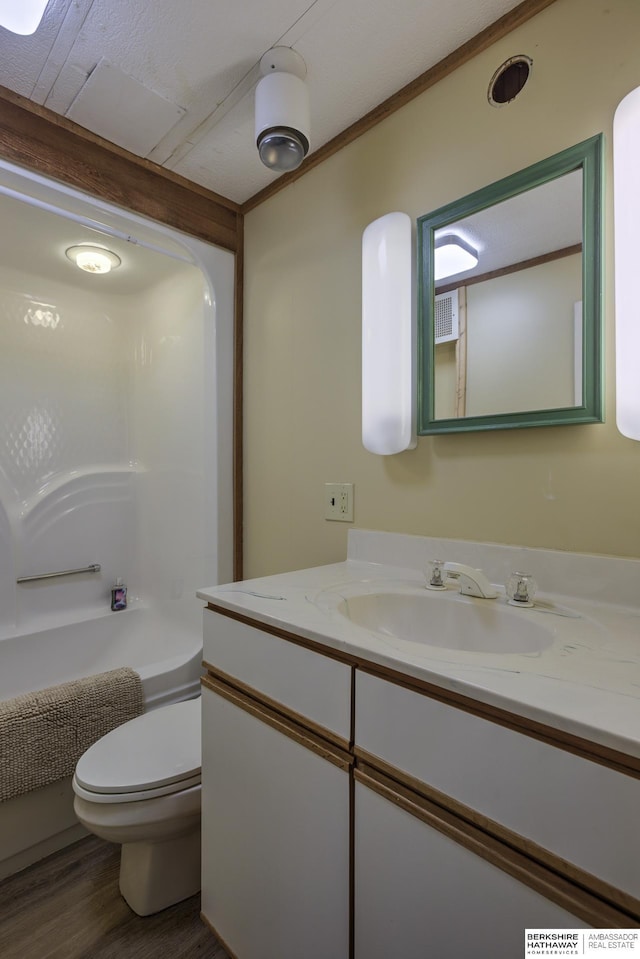 full bath with vanity, wood finished floors, visible vents, shower / bath combination, and toilet