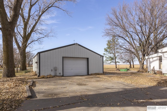 detached garage with concrete driveway