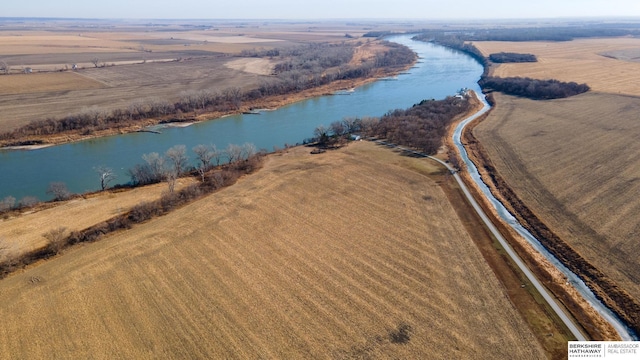 drone / aerial view featuring a rural view and a water view