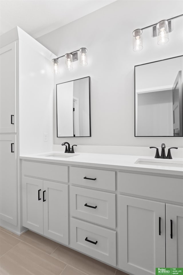 full bath featuring double vanity and a sink