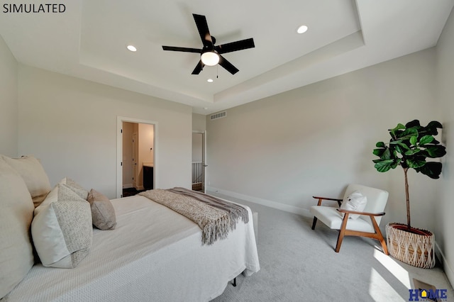 bedroom with carpet, visible vents, baseboards, recessed lighting, and a raised ceiling