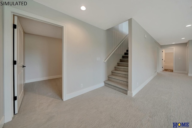 stairway featuring recessed lighting, carpet, and baseboards