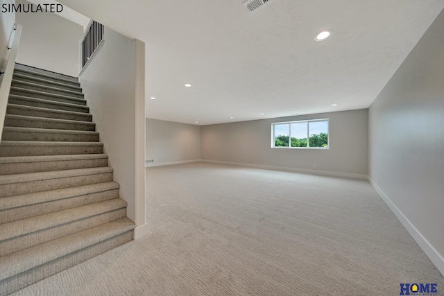 interior space featuring visible vents, recessed lighting, carpet, and baseboards