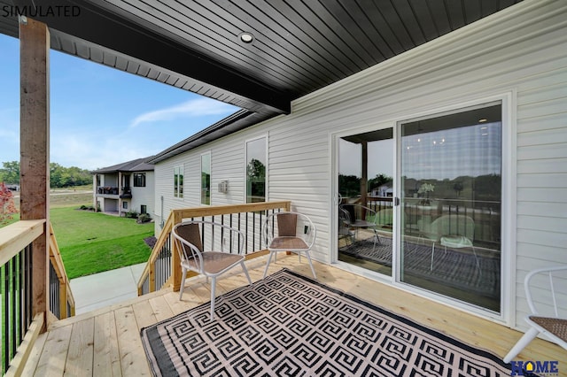 wooden deck with a yard