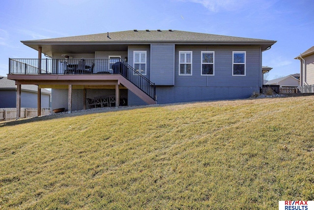 back of property with stairs, a yard, fence, and a wooden deck