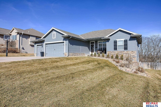 ranch-style house featuring a front lawn, fence, driveway, stone siding, and an attached garage