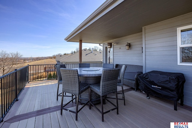 deck featuring outdoor dining area