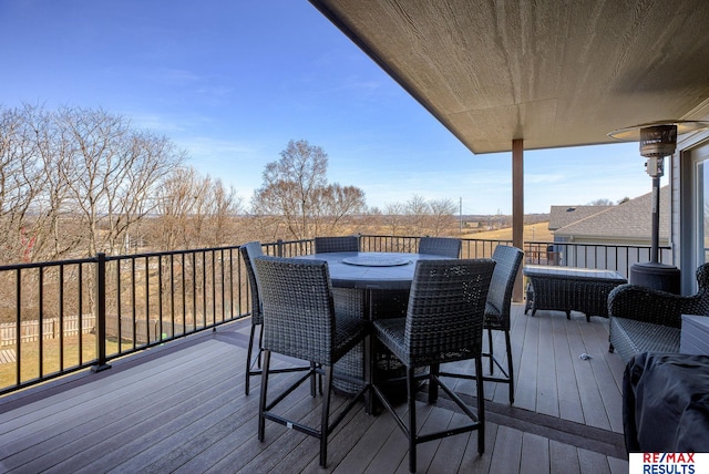 deck with outdoor dining area