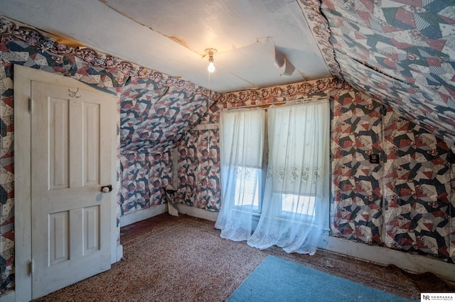 unfurnished bedroom with wallpapered walls