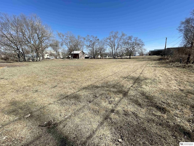 view of yard with a rural view