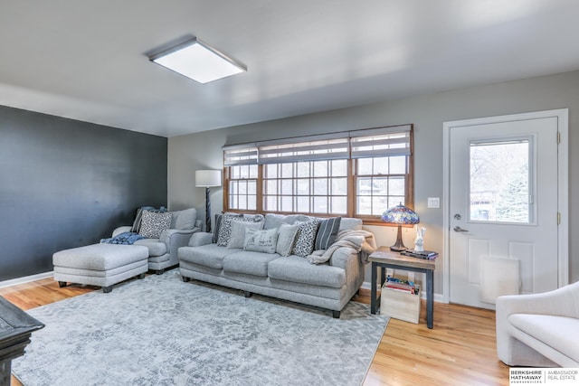 living room with wood finished floors and baseboards