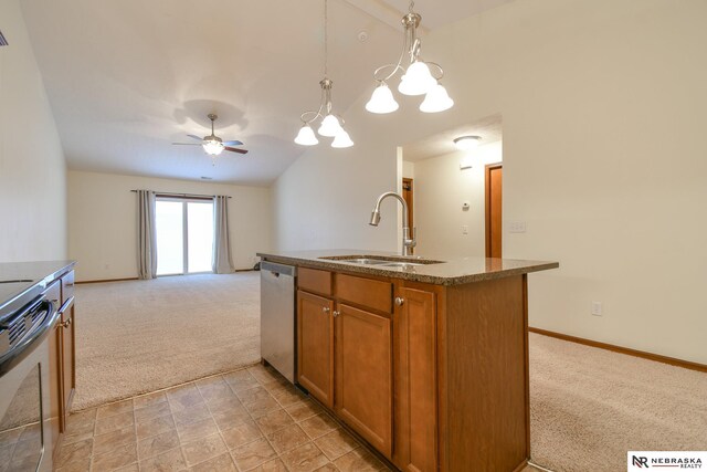 kitchen featuring lofted ceiling, light carpet, brown cabinets, stainless steel appliances, and a sink