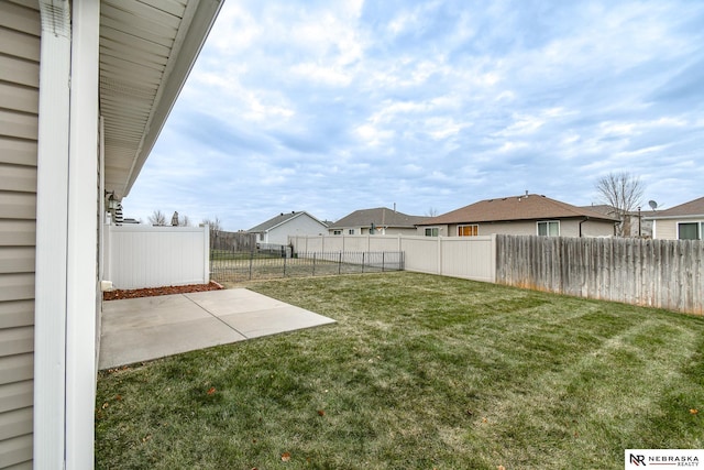 view of yard with a patio and a fenced backyard