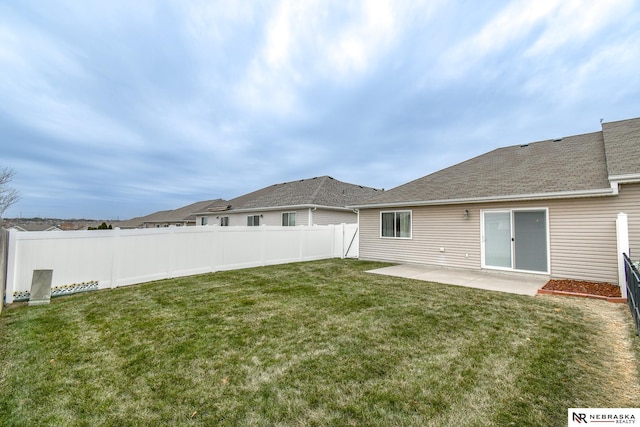 view of yard with fence and a patio area