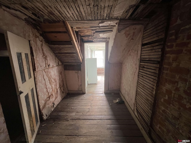 hall featuring hardwood / wood-style flooring and wooden ceiling