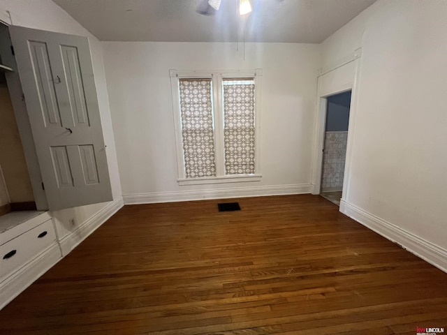 unfurnished bedroom featuring visible vents, baseboards, and wood finished floors