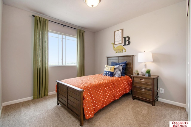 bedroom featuring baseboards and carpet floors